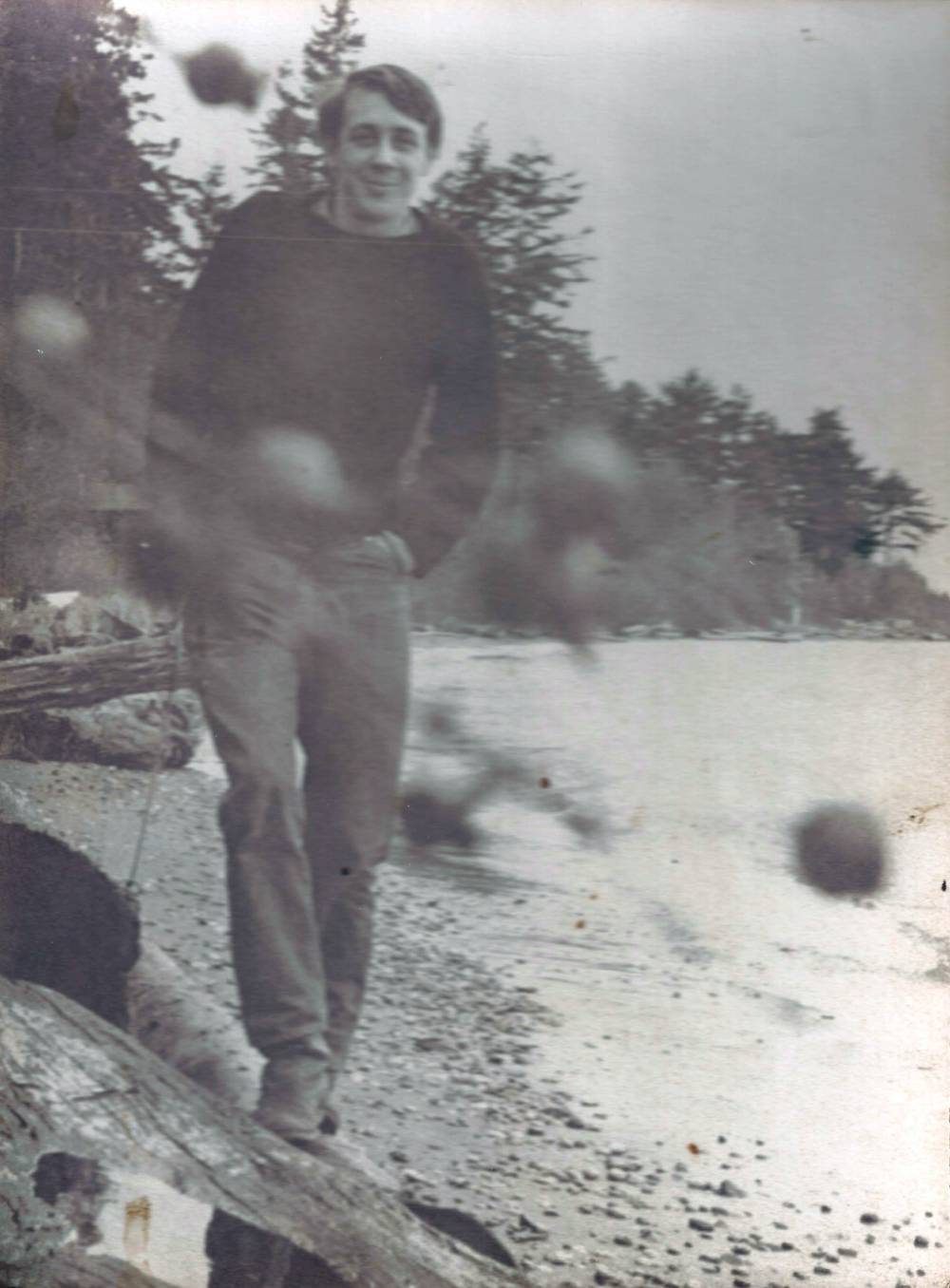 FL Decker walking along the beach aged in his early 20's